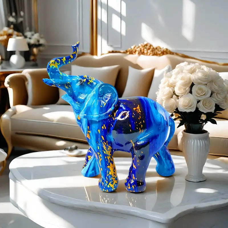 Elegante estatua de elefante azul de resina con detalles dorados