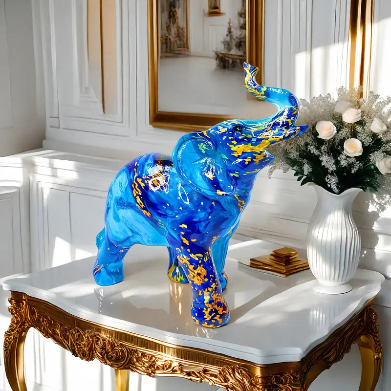 Elegante estatua de elefante azul de resina con detalles dorados