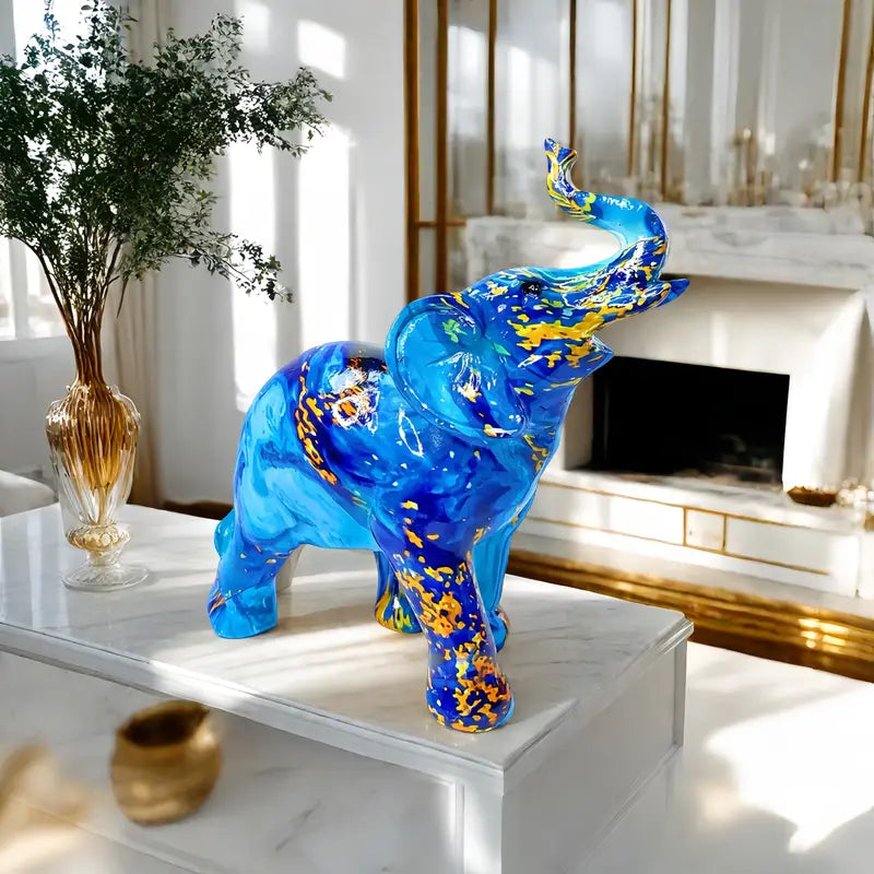 Elegante estatua de elefante azul de resina con detalles dorados